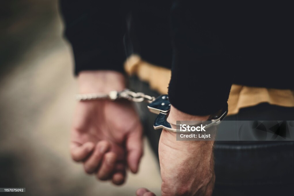 Man in handcuffs behind his back