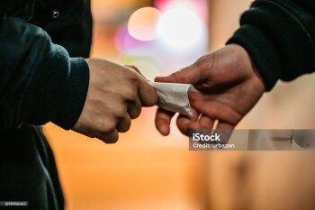 Addict young man have meeting with dealer at night to buy dose of white powder cocaine.