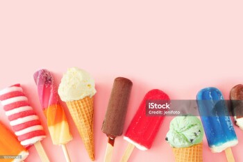 Collection of colorful summer frozen desserts. Top view bottom border on a pink background. Copy space.