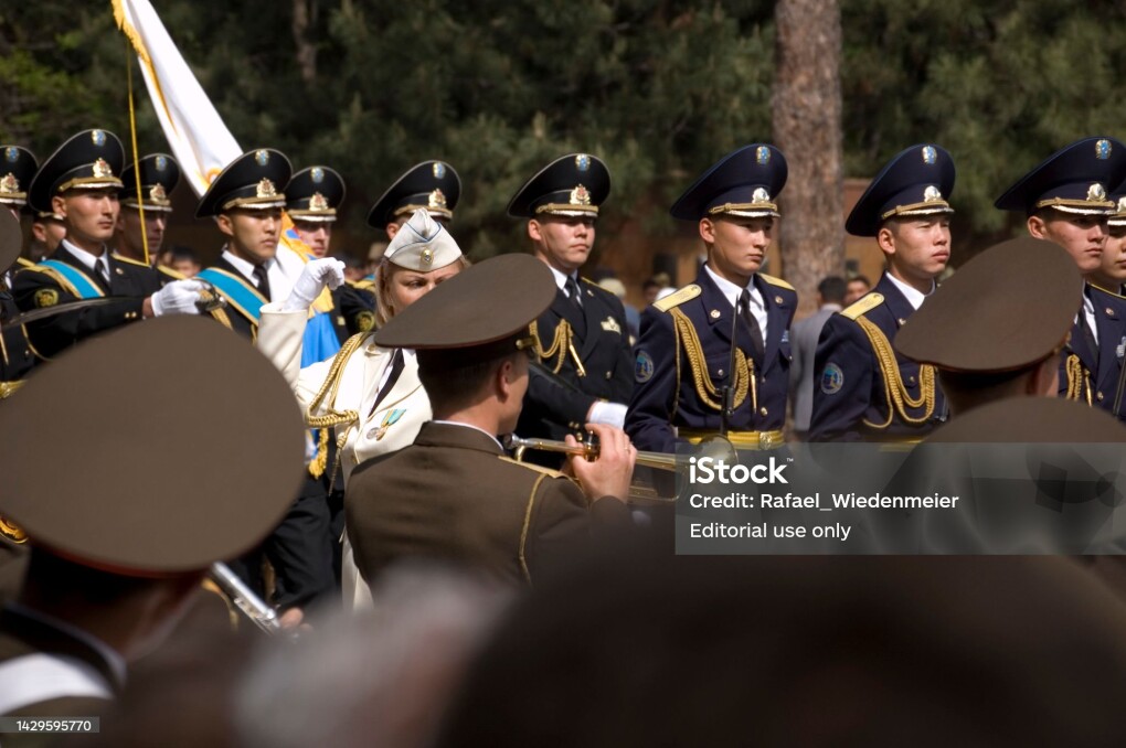 Victory Day is a celebration day that commemorates the victory of the Soviet Union over Nazi Germany in the Great Patriotic War. (Second World War). In Kazakhstan on the 9th of May the people remembering their Heros in the Panfilov Park. The image shows a military music group, captured during springtime.