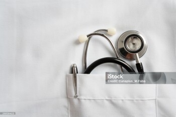 Close up of stethoscope and pen in doctor robe pocket. Concept Of The Global Healthcare, Medicine And Insurance with copy space.