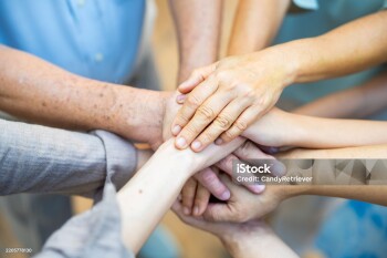 Close up of Happy three generation Asian family stack hand together. Big family adult couple, grandparents and grandchildren spending time together. Family relationship support each other with love.