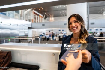 Airline attendant picking the passenger's passport at the airport