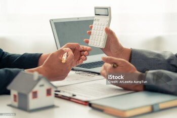 The real estate agent discussed the terms of the home purchase contract and asked the client to sign the document to legally complete the contract.