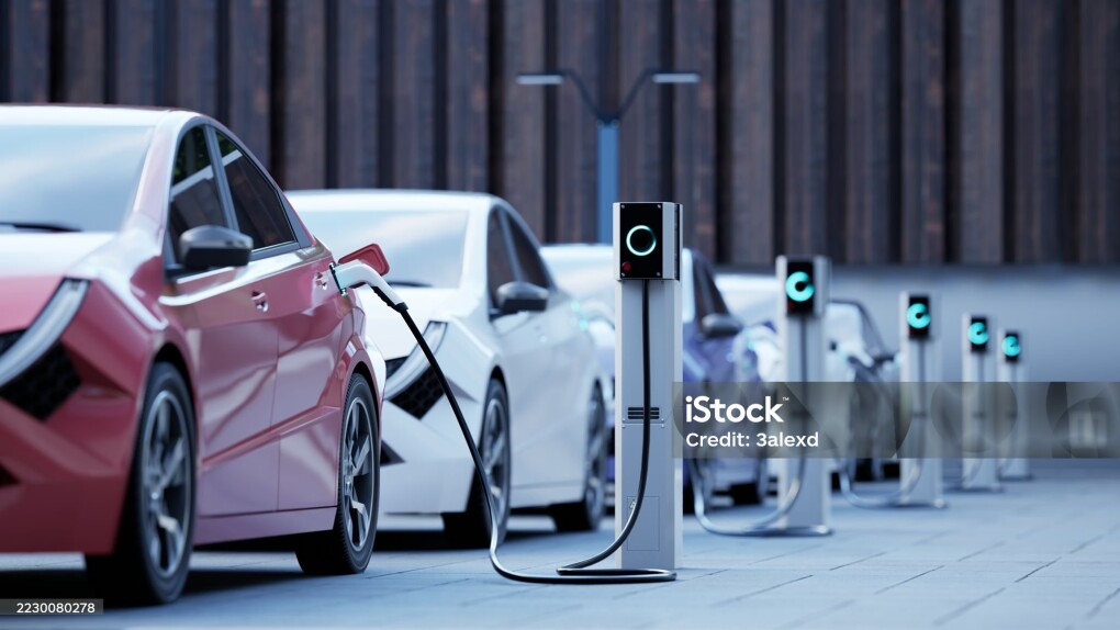 Generic electric car charging on a city street