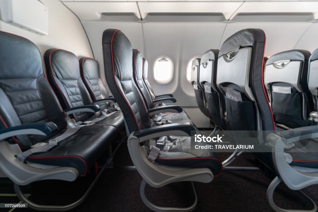 Airplane seats and windows. Economy class comfortable seats without passengers. New low-cost carrier airline