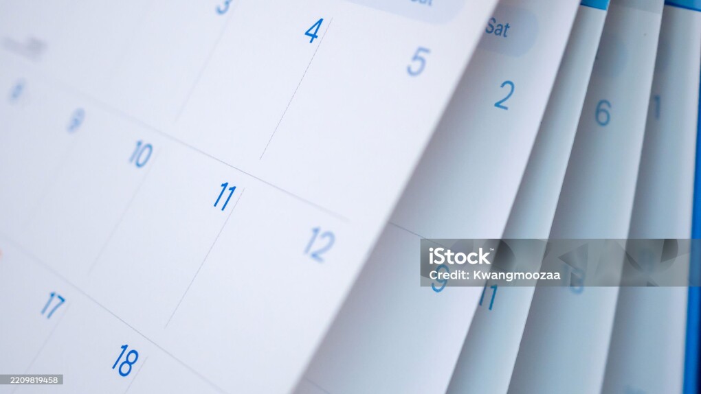 Abstract blur calendar page flipping sheet close up background business schedule planning appointment meeting concept