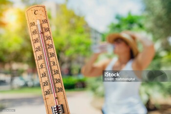 Thermometer showing dangerous outdoors high temperature and woman drinking water. Thirsty or heat stroke. Summer heat wave, concept of global warming