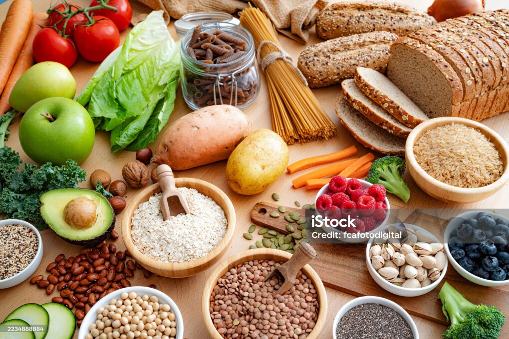 Food ingredients with high dietary fiber content. Fruits, vegetables, whole grains, nuts and berries. Healthy eating and dieting concept. Raw food recommded for a healthy digestive system