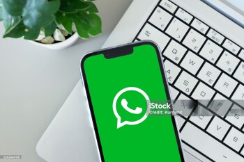 WHATSAPP app icon on smartphone screen over laptop. ADANA-TURKEY - 20 OCTOBER -2025