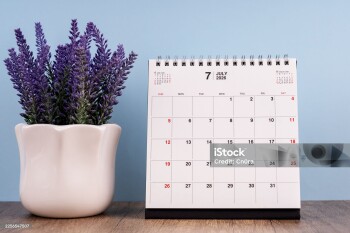 July 2026 desk calendar on a table