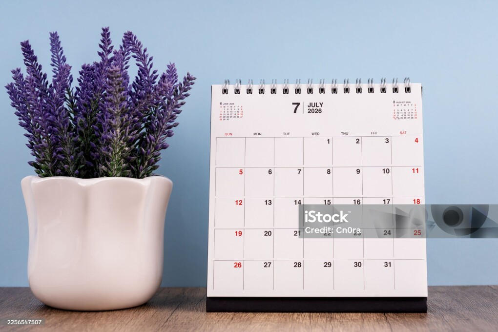 July 2026 desk calendar on a table