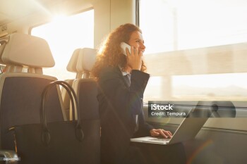 Single business woman commuting, on the move. More of same series on port.