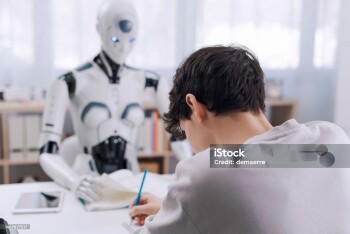 A Boy studies with the help of a Robot. The result is fruitful. Robot and Human Collaboration Concept.