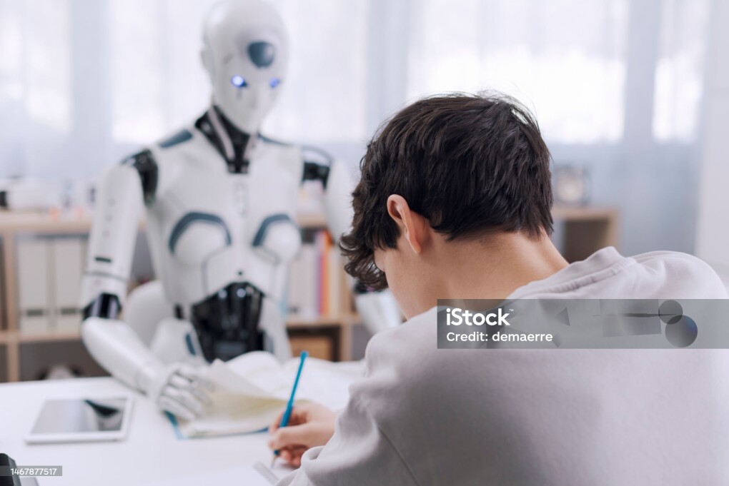 A Boy studies with the help of a Robot. The result is fruitful. Robot and Human Collaboration Concept.
