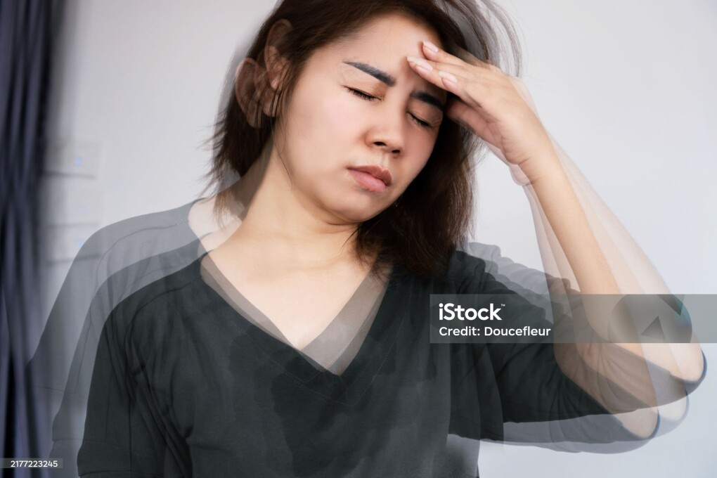 Asian woman suffering from Anemia feeling dizzy and vertigo , weakness and shortness of breath