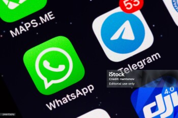 Moscow, Russia - December 13, 2024: Two most popular in the world messengers WhatsApp and Telegram app icons on display of an iPhone.