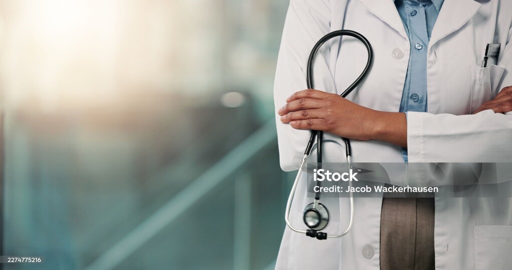 Hospital, hands and doctor with stethoscope, arms crossed or medical professional with tool or space. Clinic, healthcare worker and person with equipment for health services, wellness and medicine