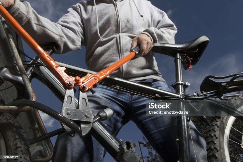 A royalty free image from sports and recreation of a bike theft in progress.