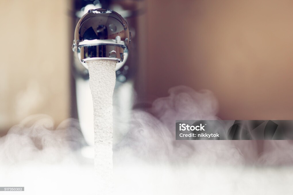 water tap with hot water steam, closeup view