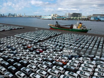 A lot of cars are lined up for importing and exporting cars to the port.