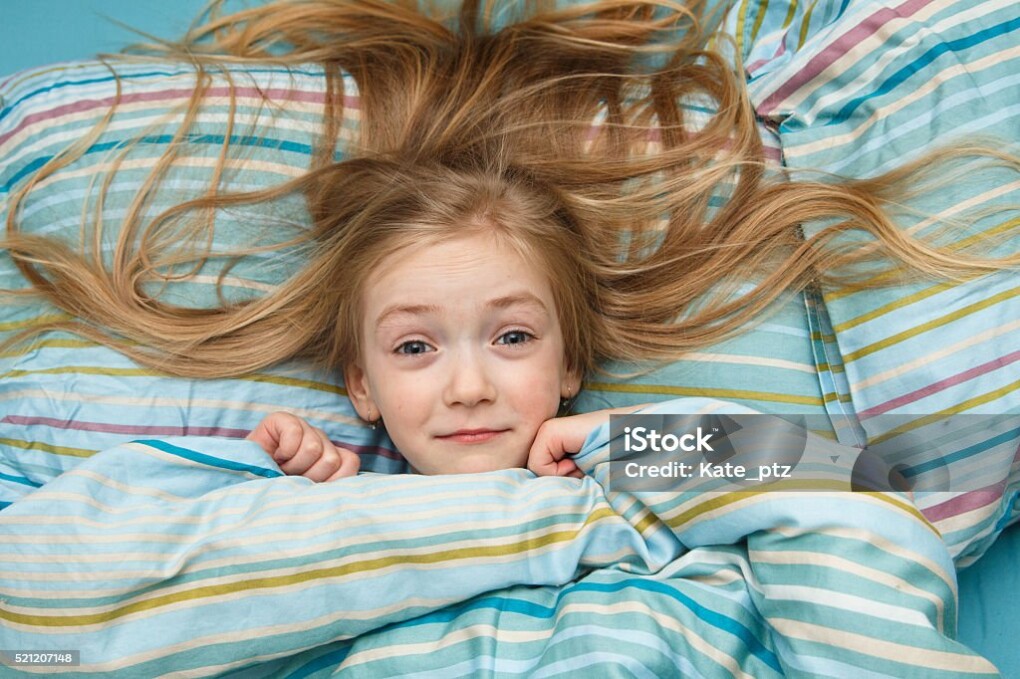 Little girl 5 years old with long blonde hair scared in the dream and woke upLittle girl 5 years old with long blonde hair scared in the dream and woke up