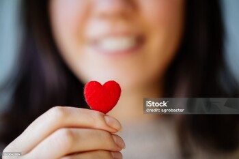 Woman Holding Tiny Heart