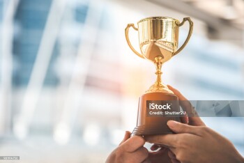 Champion golden trophy for winner background. Success and achievement concept. Sport and cup award theme.